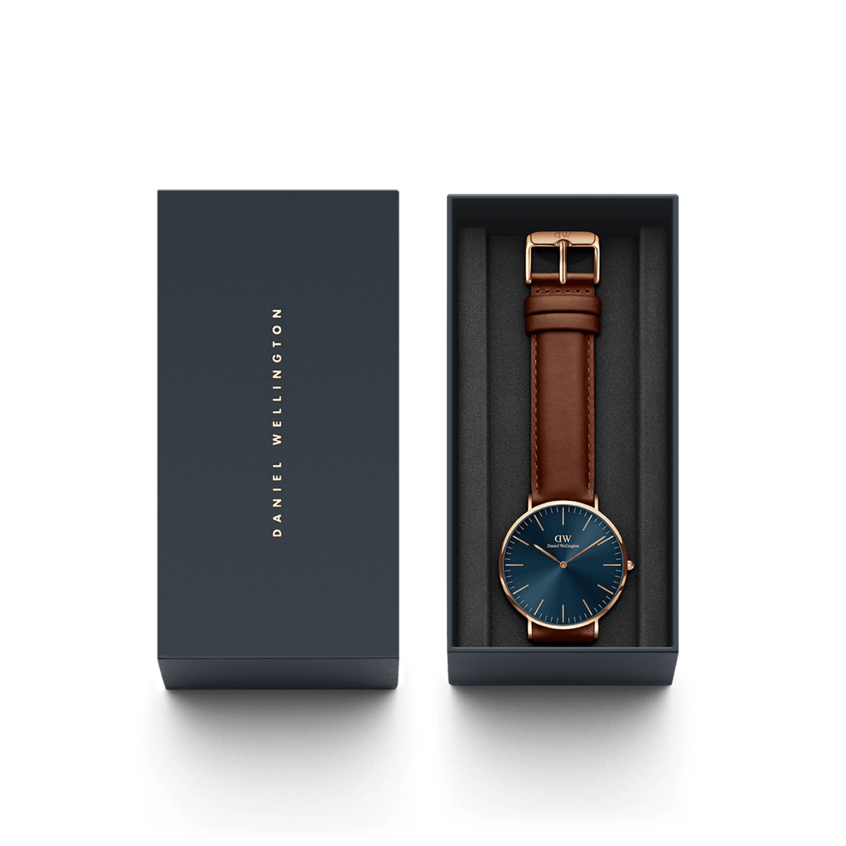 Classic St Mawes Arctic Rose Gold watch with a blue dial and brown leather strap, elegantly presented in a branded Daniel Wellington gift box.