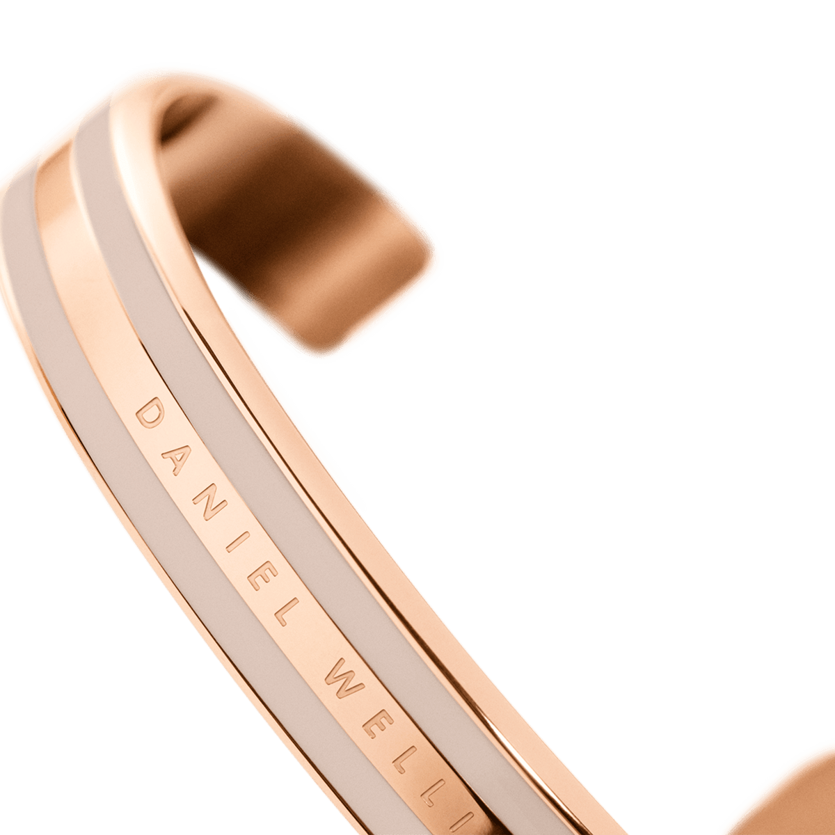 Detail view of the Emalie Bracelet Desert Sand Rose Gold, showing the rose gold and desert sand enamel finish with Daniel Wellington branding on the sleek cuff.