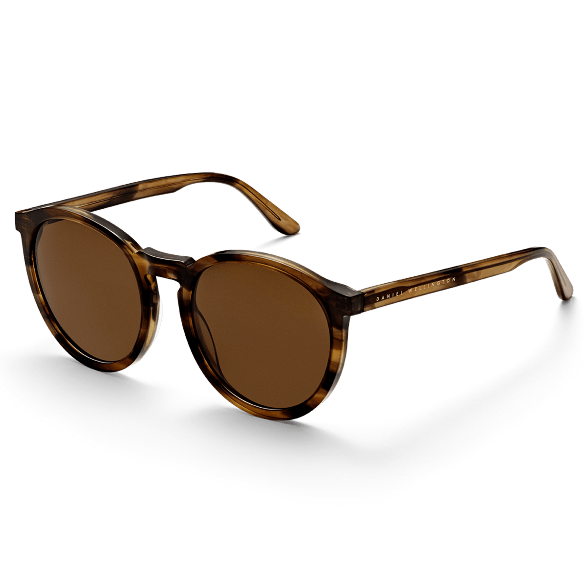 Bio-Acetate Arch Brown Demi sunglasses with a round brown demi frame, amber coloured lenses, and Daniel Wellington branding on the temples, shown at an angle to highlight the lightweight bio-acetate construction.