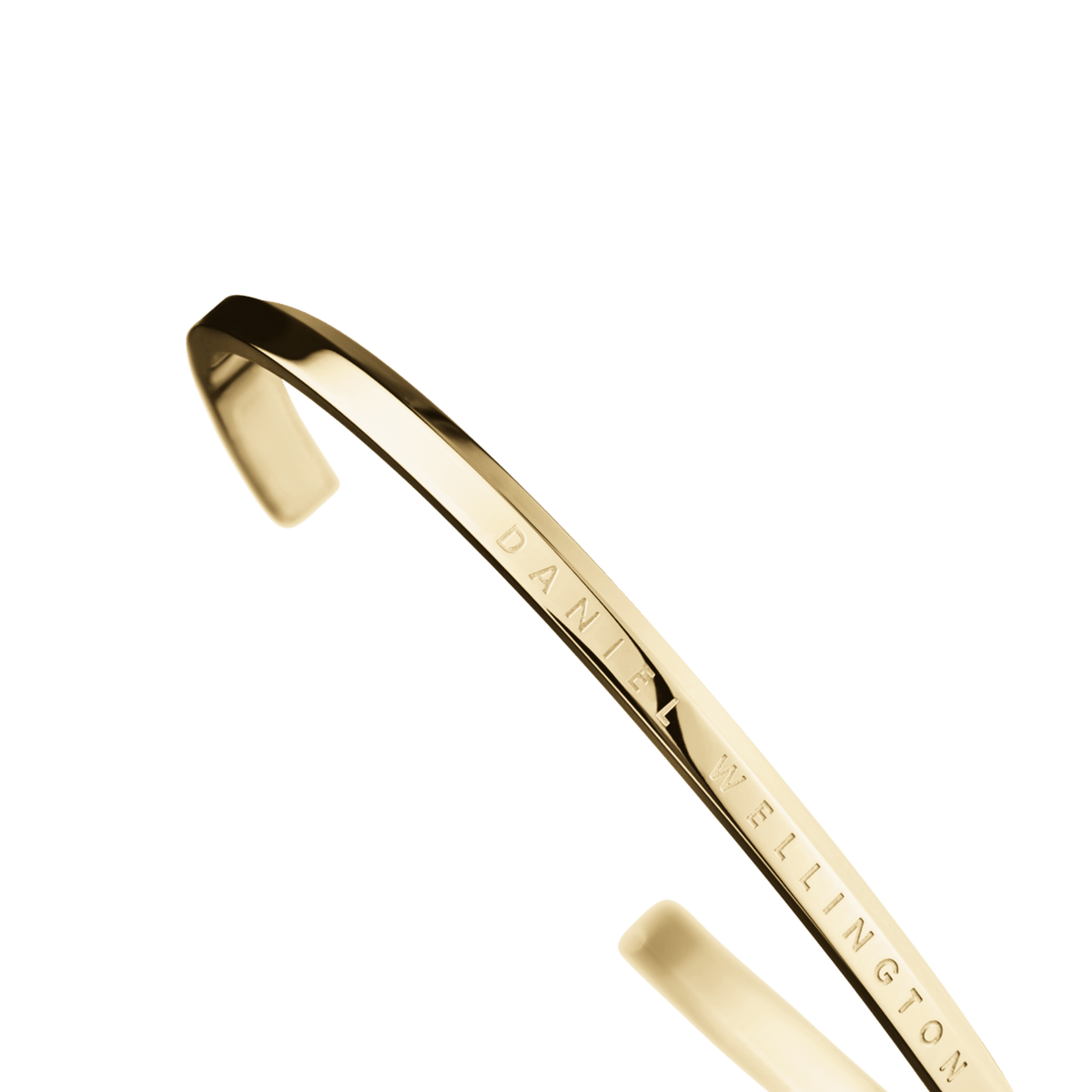 Classic Bracelet Gold shown in close-up, highlighting the curved, polished gold cuff and engraved Daniel Wellington logo, with a minimalist and elegant finish.