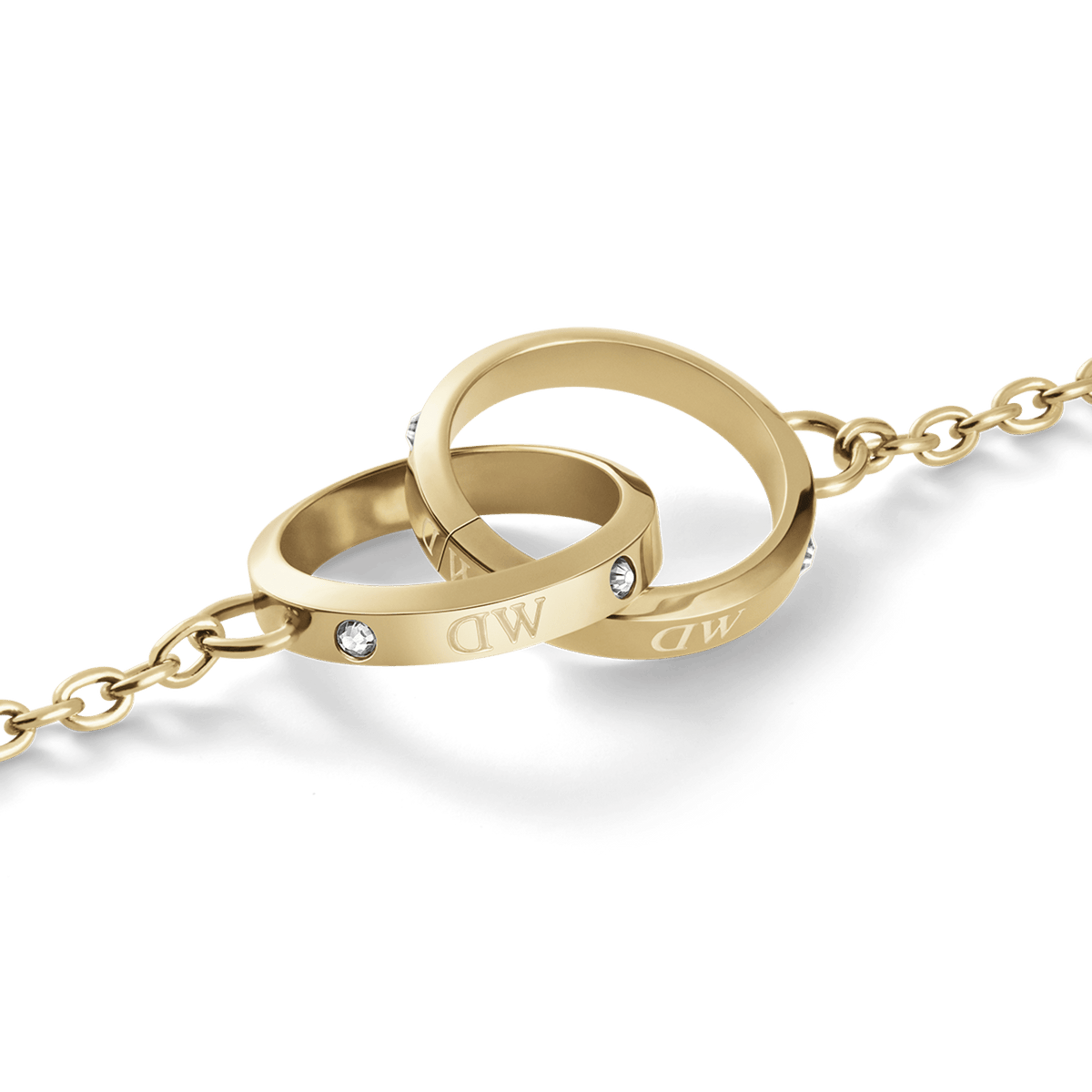 Close-up of the Classic Lumine Unity Gold necklace pendant, showing two polished gold interlocking rings with Preciosa® crystal detailing and a delicate chain.