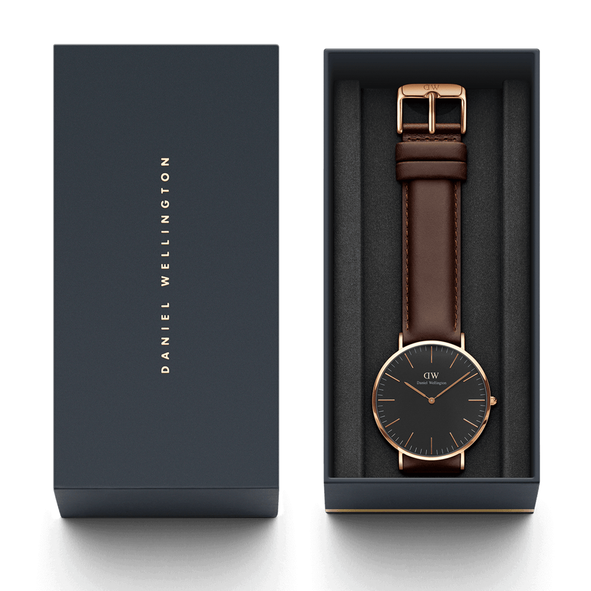 Classic Bristol Black Rose Gold watch with a black dial, rose gold case, and dark brown leather strap, presented in a Daniel Wellington branded gift box.