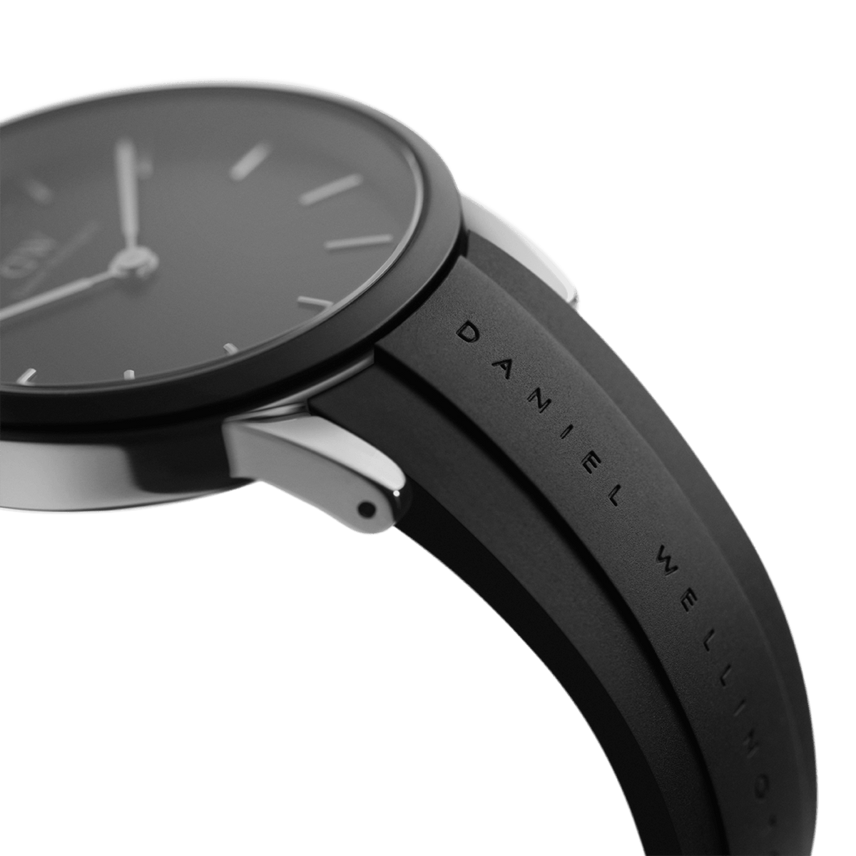Close-up of the Daniel Wellington Iconic Motion Silver watch showing the engraved branding on the black FKM rubber strap and the polished silver case.