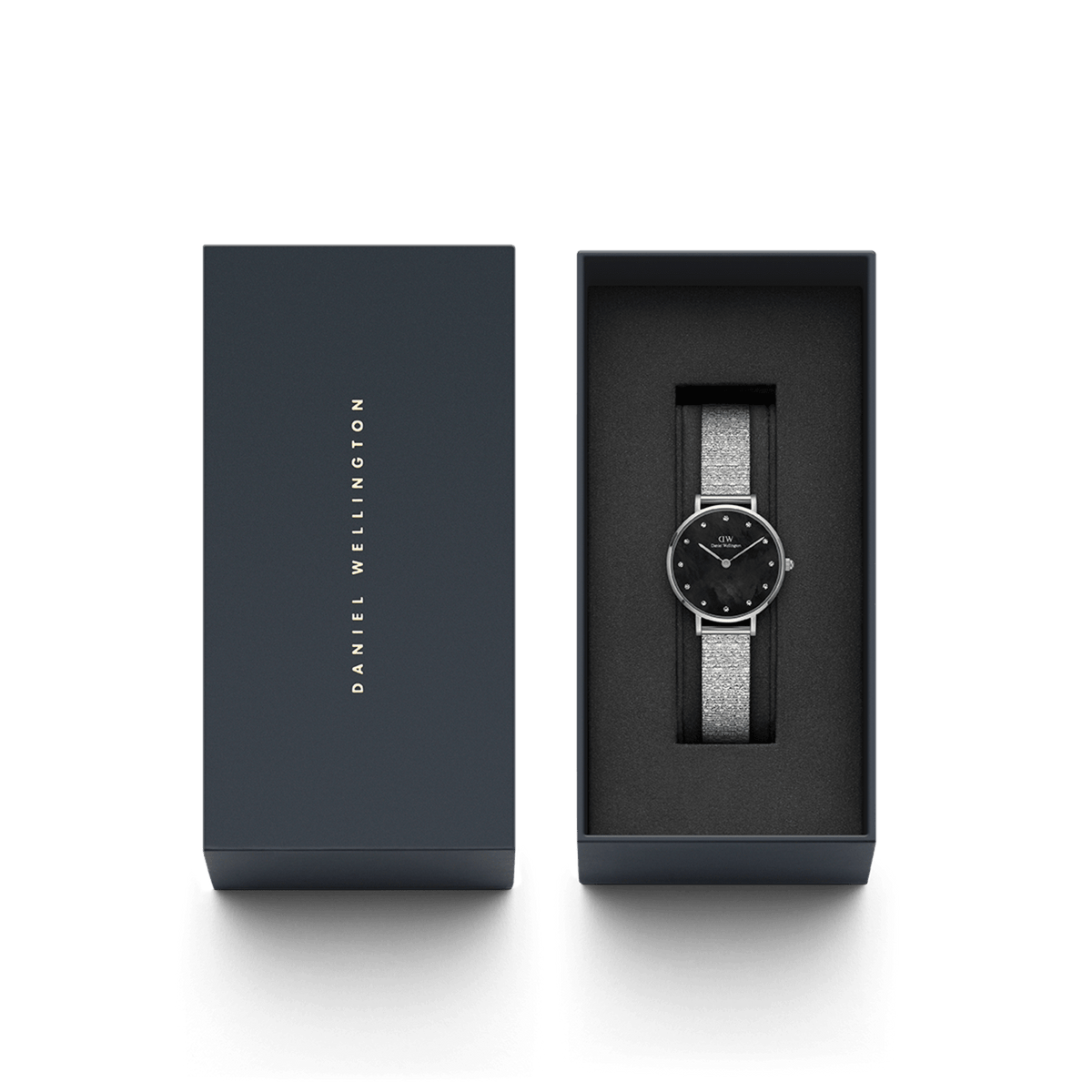 Petite Lumine Pressed Piano Black MoP Silver watch with a black mother of pearl dial and silver mesh-inspired strap, elegantly presented in a Daniel Wellington gift box.
