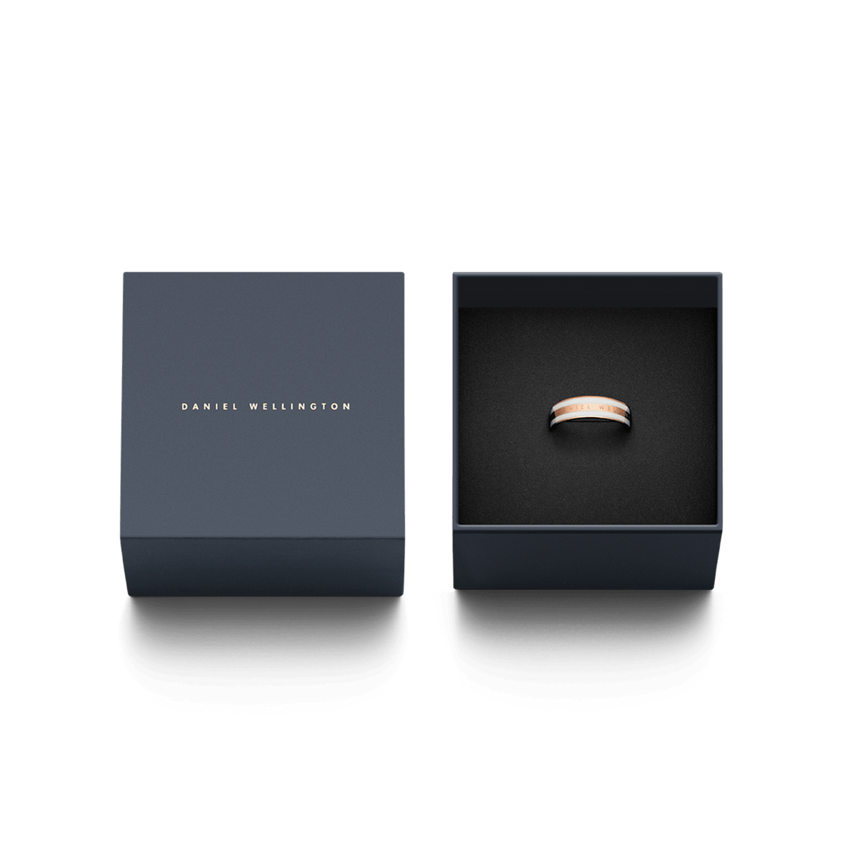 Daniel Wellington Emalie Ring Satin White Rose Gold presented in a sleek navy gift box, highlighting the rose gold band with satin white enamel detailing as a stylish and thoughtful jewellery gift.