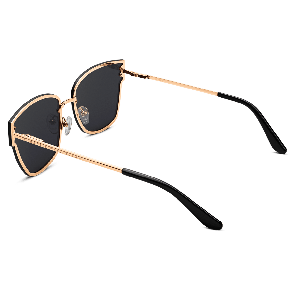 Steel Grande Rose Gold sunglasses with oversized square black lenses, rose gold plated stainless steel frame, and comfortable black acetate temple tips, shown from a rear angle highlighting the adjustable silicone nose pads.