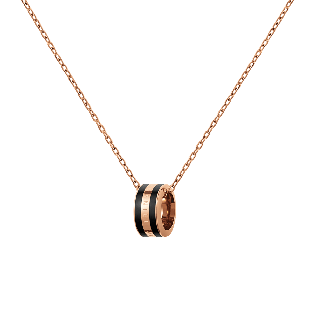 Rose gold chain necklace featuring a circular black enamel pendant with engraved detailing, showcasing a minimalist and modern design suitable for everyday wear or layering with other jewellery.