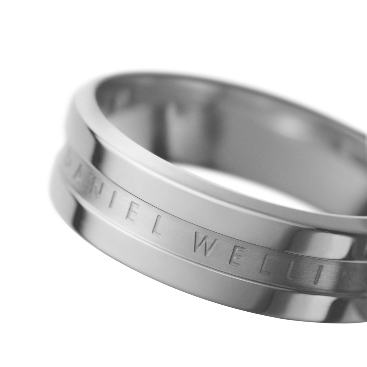 Close-up of the Elan Ring Silver showing its polished stainless steel finish, minimalist band design, and the subtle engraved Daniel Wellington logo.
