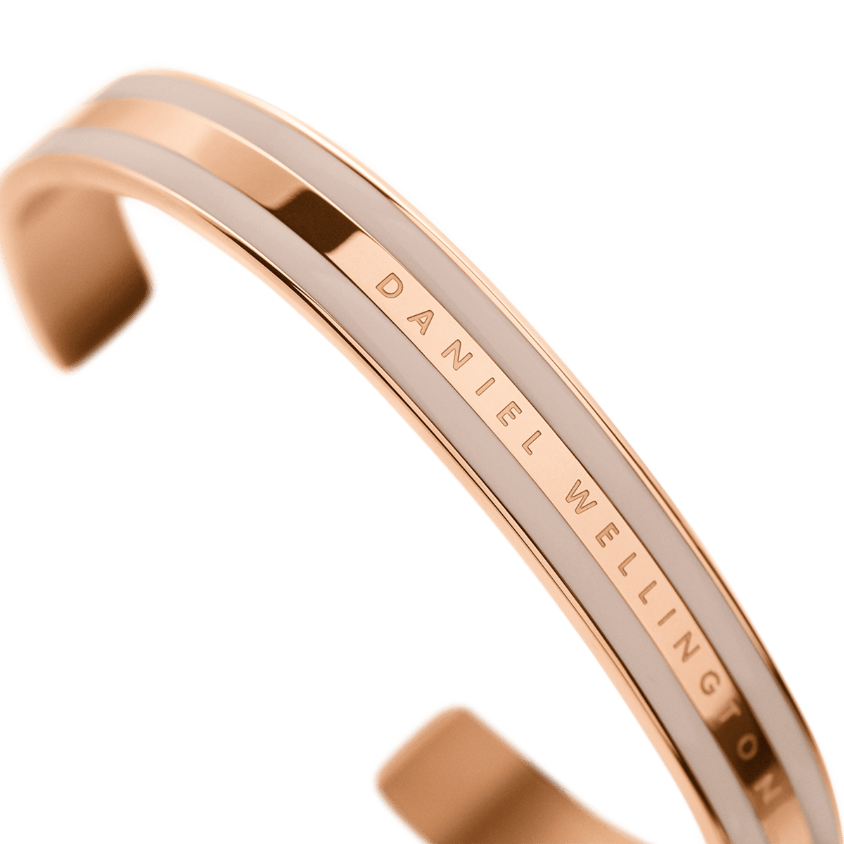 Close-up of the Emalie Bracelet Desert Sand Rose Gold, highlighting the rose gold finish, desert sand enamel detailing, and Daniel Wellington branding on the minimalist cuff.