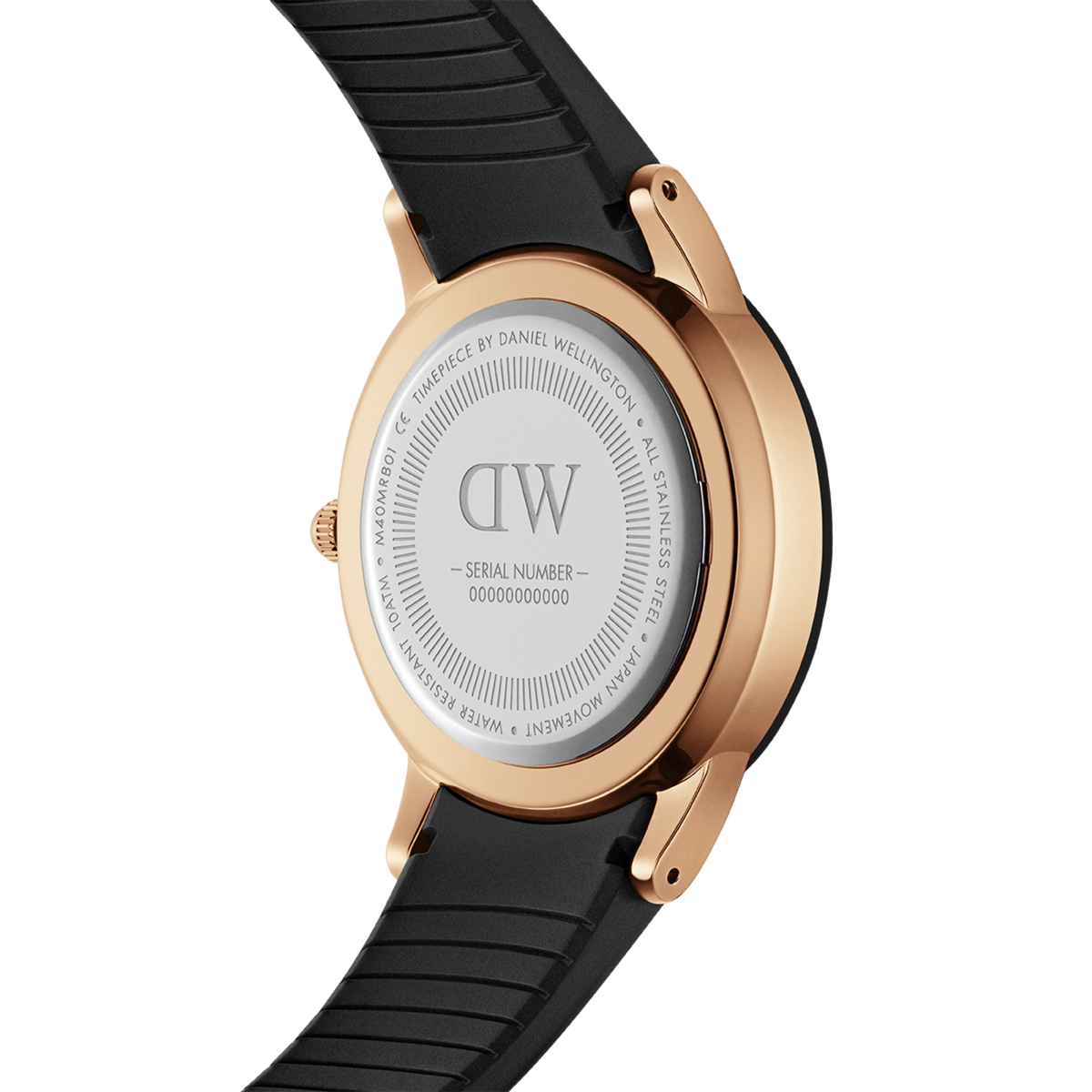 Back view of the Daniel Wellington Iconic Motion Rose Gold watch, showing the rose gold stainless steel case, engraved case back, and textured black FKM rubber strap.
