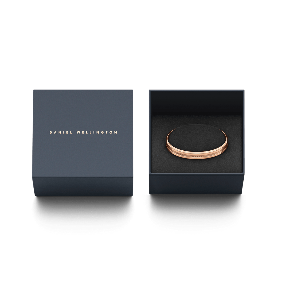 Elan Bracelet Rose Gold by Daniel Wellington presented in a navy gift box, highlighting its polished rose gold finish and engraved logo, ideal for gifting or adding to a jewellery collection.