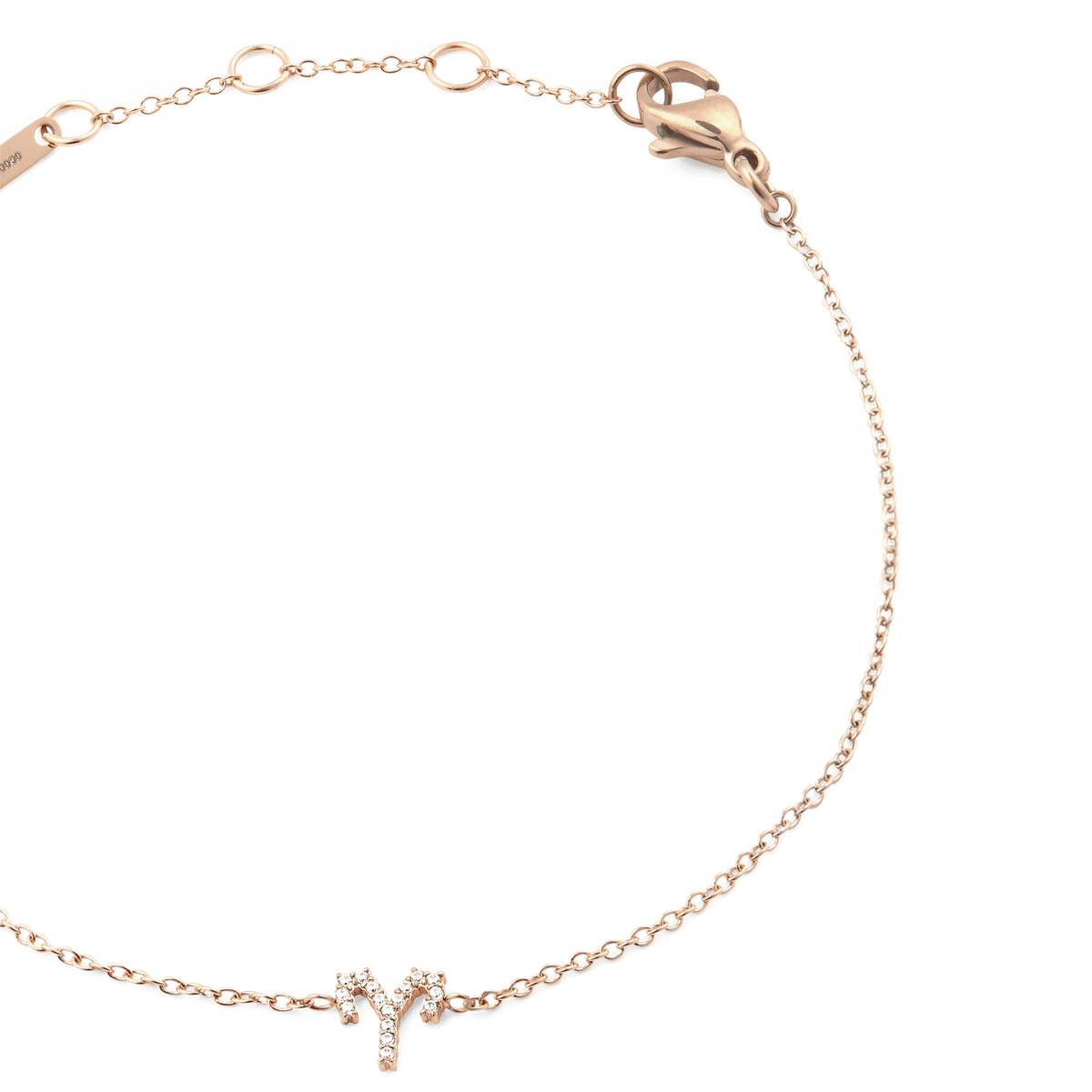 Close-up of the Crystal Zodiac Chain Bracelet Rose Gold, highlighting the slim rose gold chain, adjustable sizing rings, and a sparkling crystal zodiac pendant.
