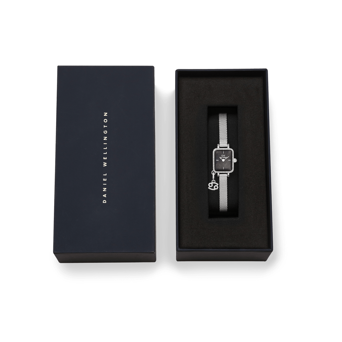 Quadro Mini Crystal Zodiac Sterling Set presented in a sleek Daniel Wellington gift box, featuring a silver ladies watch with crystal-framed rectangular case, black mother of pearl dial, mesh strap, and detachable zodiac charm.