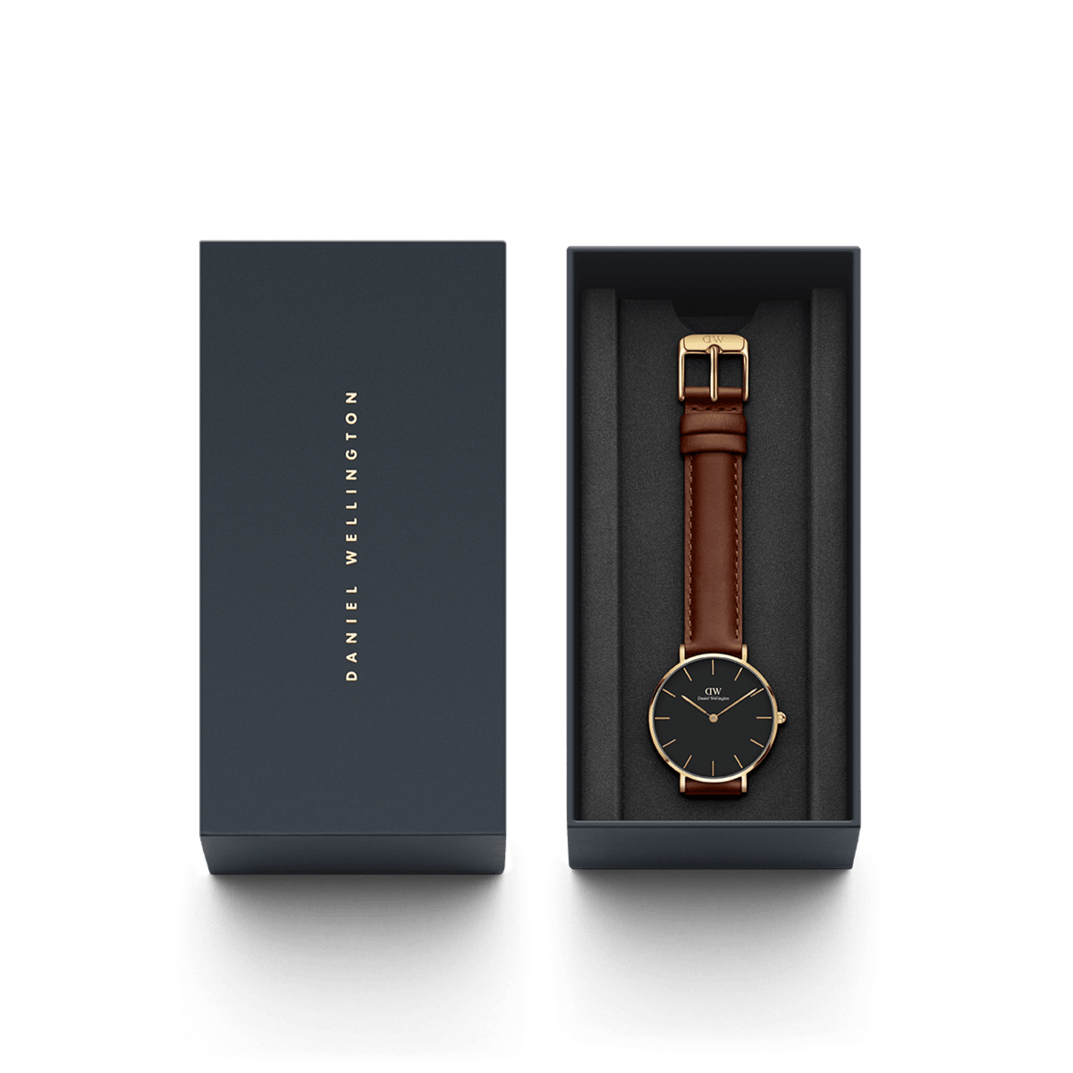 Petite St Mawes Black Gold watch presented in a sleek Daniel Wellington gift box, featuring a gold-plated case, black dial, and brown leather strap for elegant gifting or personal use.