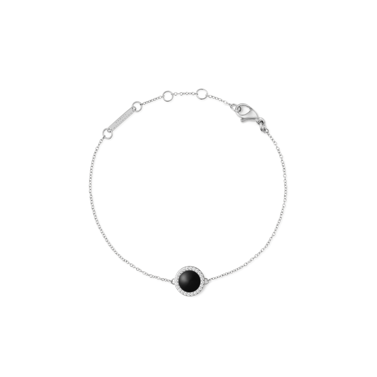 A delicate silver bracelet featuring a slim adjustable chain and a round black agate centrepiece framed by sparkling white cubic zirconia, designed for a refined and timeless look.
