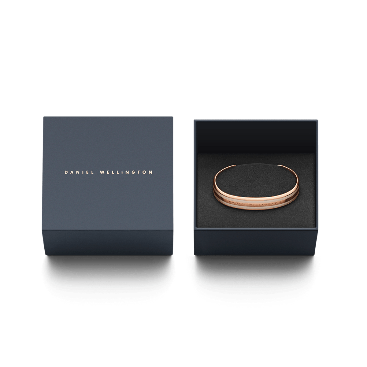 Emalie Bracelet Desert Sand Rose Gold presented in a navy Daniel Wellington gift box, highlighting the rose gold cuff and desert sand enamel detail as a stylish jewellery gift option.