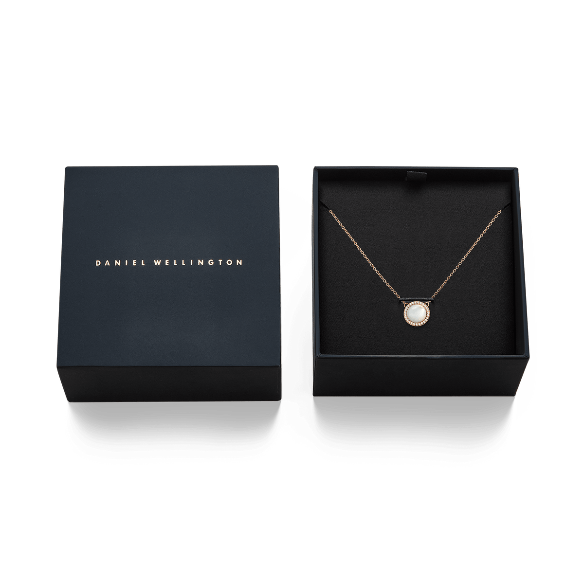 Audrey Necklace Mother of Pearl Rose Gold presented in an elegant black Daniel Wellington gift box, with the rose gold chain and domed mother of pearl pendant neatly displayed.