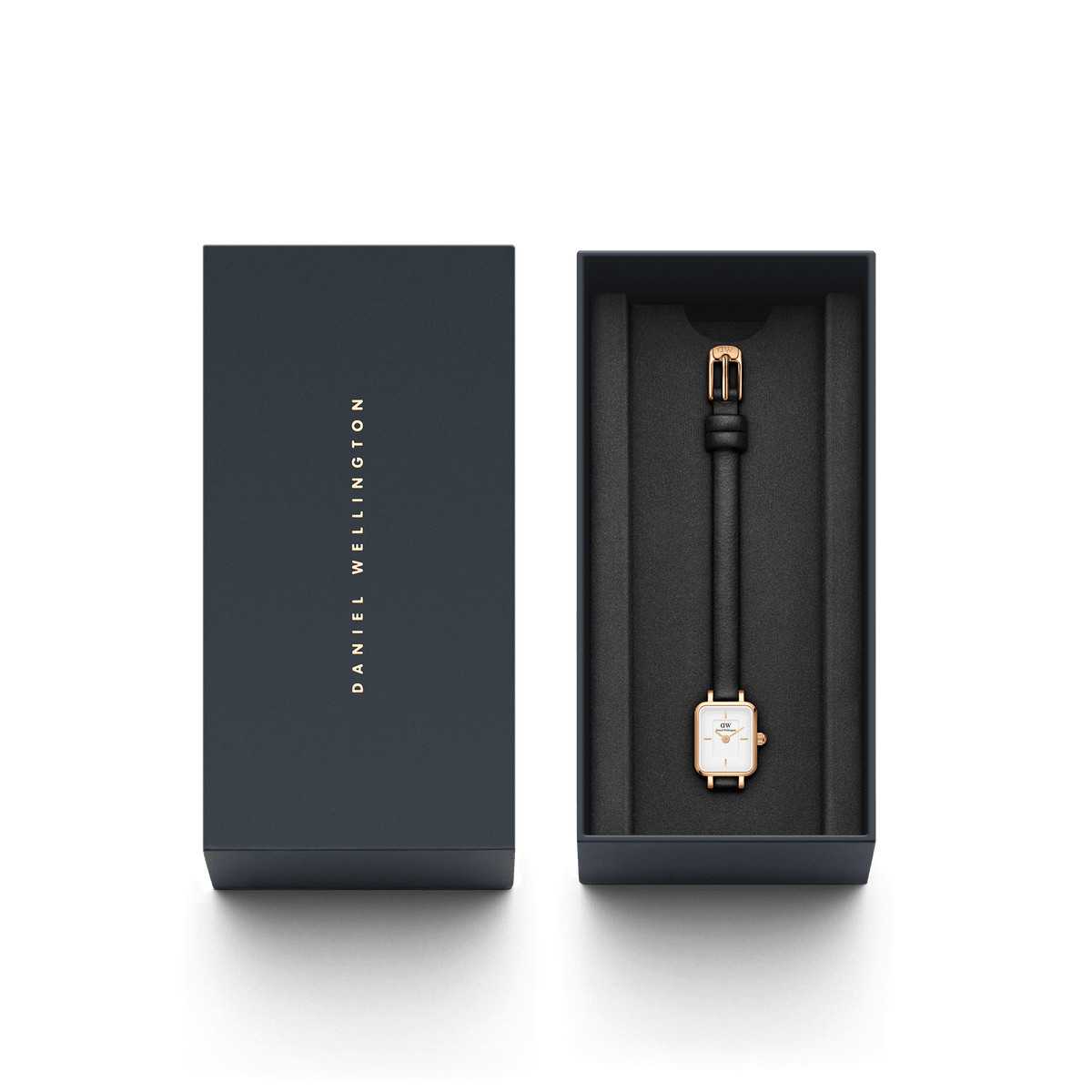 Quadro Mini Sheffield Rose Gold ladies watch presented in a sleek Daniel Wellington gift box, featuring a petite rectangular rose gold case, minimalist white dial, and slim black leather strap.