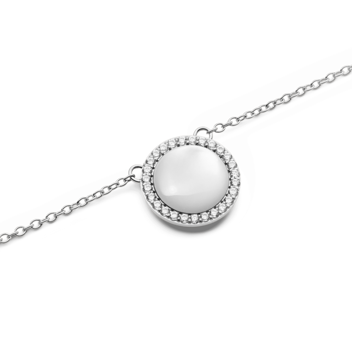 Close-up of the Audrey Necklace Mother of Pearl Silver, showing a domed mother of pearl pendant surrounded by a halo of sparkling white cubic zirconia crystals on a polished silver chain.