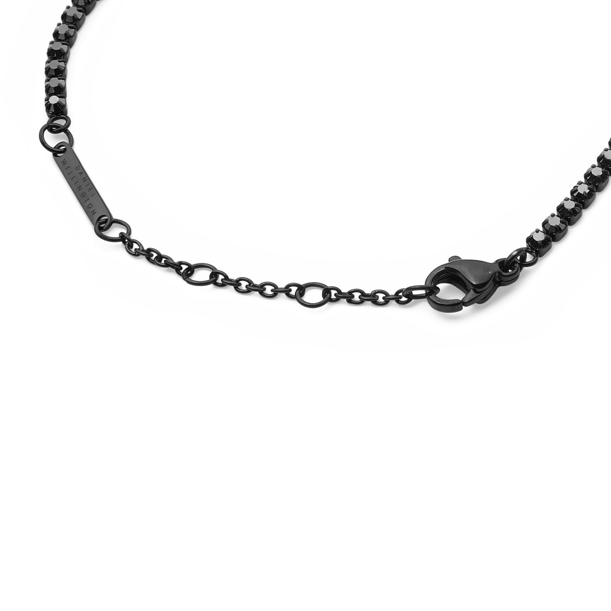 Detail view of the Black Crystal Tennis Bracelet highlighting the lobster clasp, adjustable sizing rings, and sparkling black crystals set in a sleek stainless steel chain.