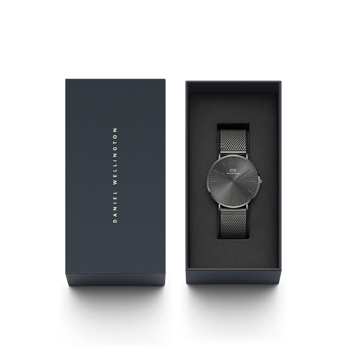 Classic Mesh Graphite watch with a graphite grey stainless steel mesh strap and minimalist sunray dial, elegantly presented in a dark gift box with Daniel Wellington branding.