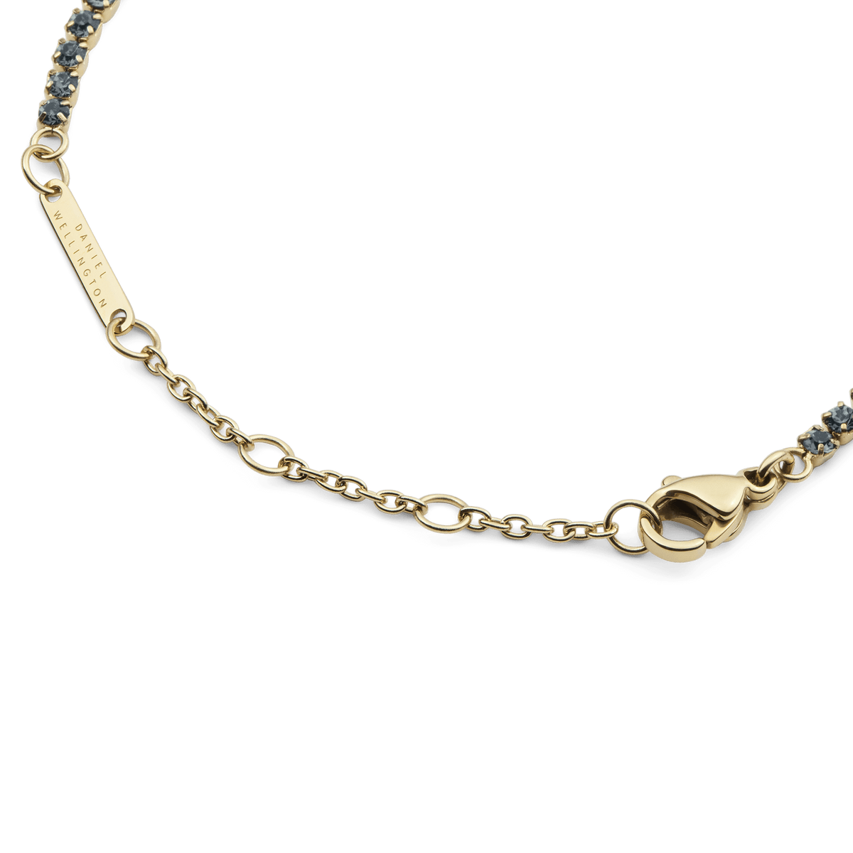 Detailed view of the Classic Tennis Bracelet Nightfall Gold, highlighting the gold chain, lobster clasp, sizing rings, and individually set deep-coloured Preciosa crystals.
