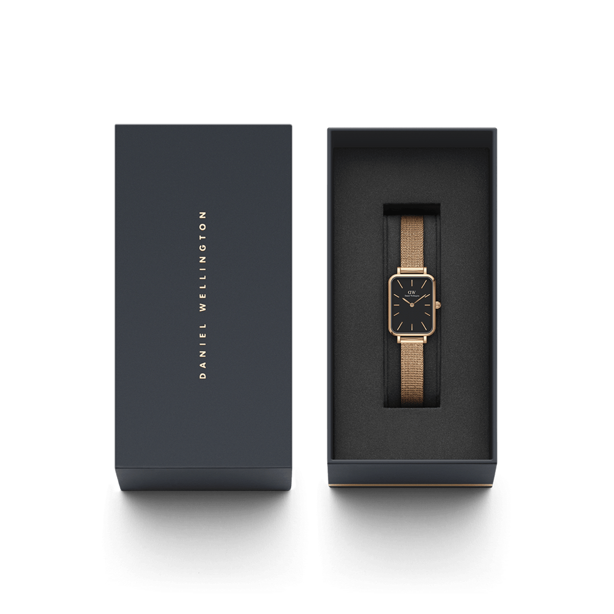 Quadro Pressed Melrose Black Rose Gold watch presented in a sleek Daniel Wellington gift box, featuring a slim rectangular black dial and rose gold mesh bracelet.