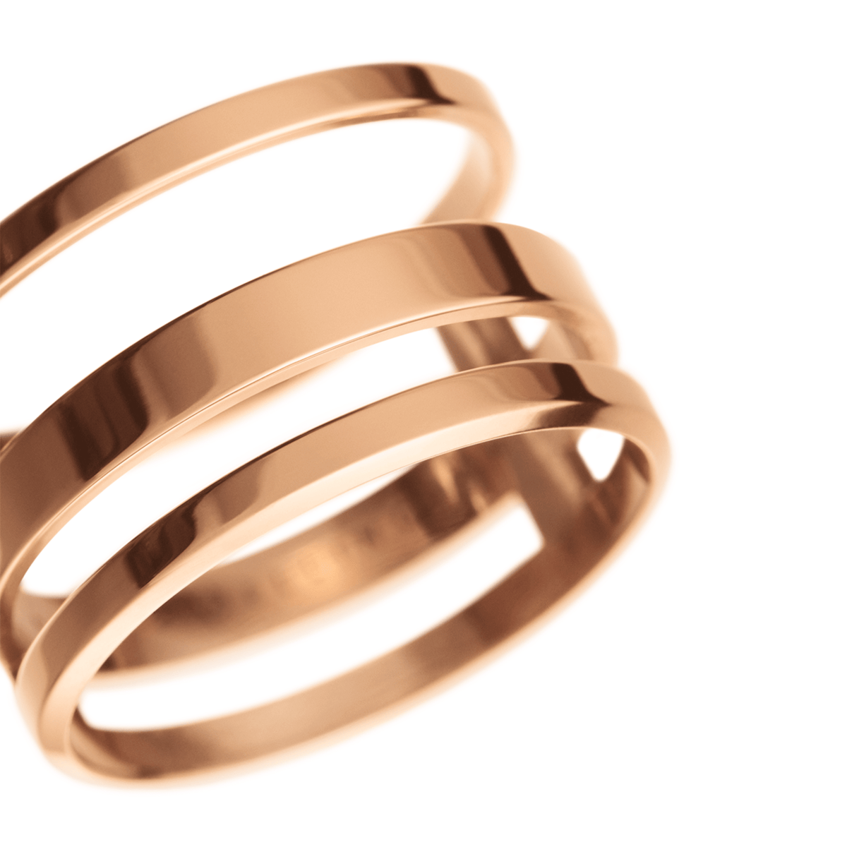 Close-up of the Elan Triad Ring Rose Gold showing its polished triple band design and smooth rose gold finish, ideal for modern jewellery collections.