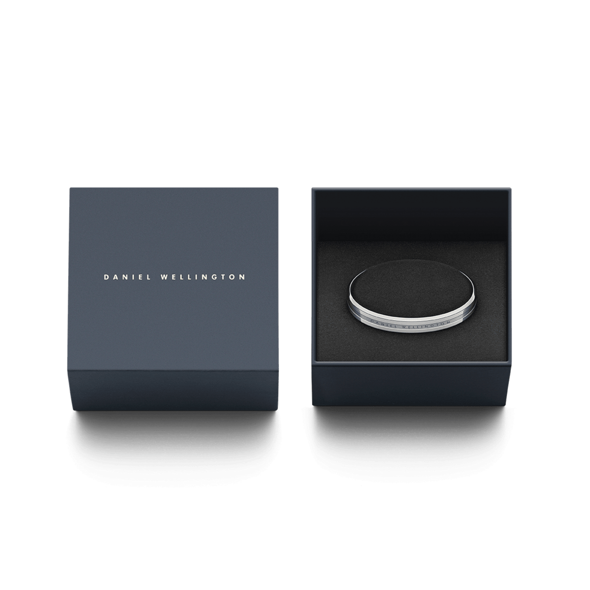 Elan Bracelet Silver presented in a navy Daniel Wellington gift box, highlighting its polished stainless steel finish and engraved logo for a classic gifting experience.