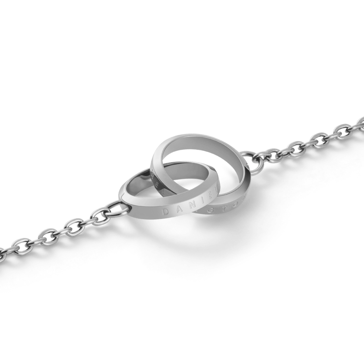 Close-up of the Elan Unity Bracelet Silver showing two polished interlocking rings as the pendant on a fine silver chain, crafted in stainless steel for a modern, elegant finish.