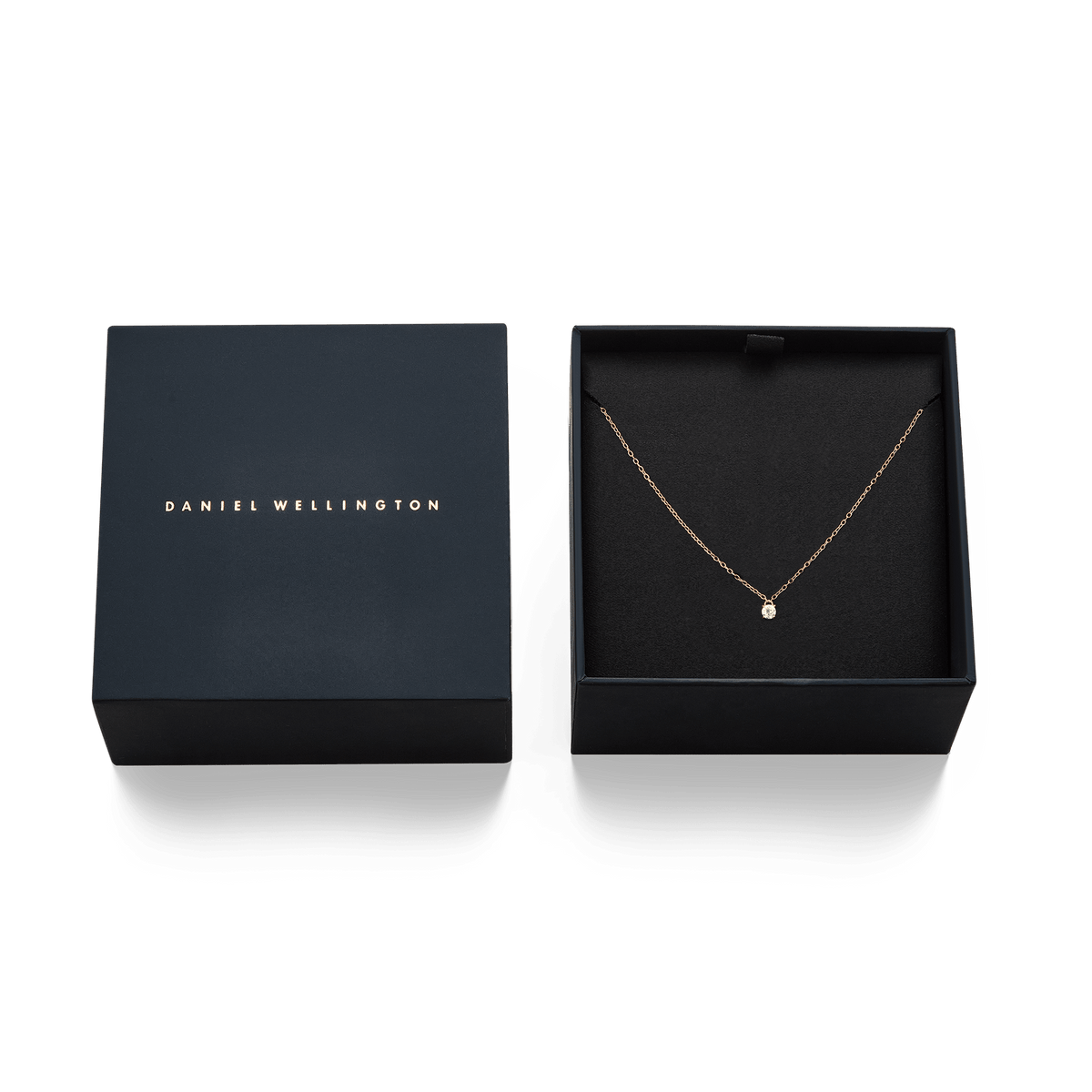 Mirelle Solitaire Necklace Rose Gold displayed in an elegant black gift box, highlighting the delicate rose gold chain and white cubic zirconia pendant.