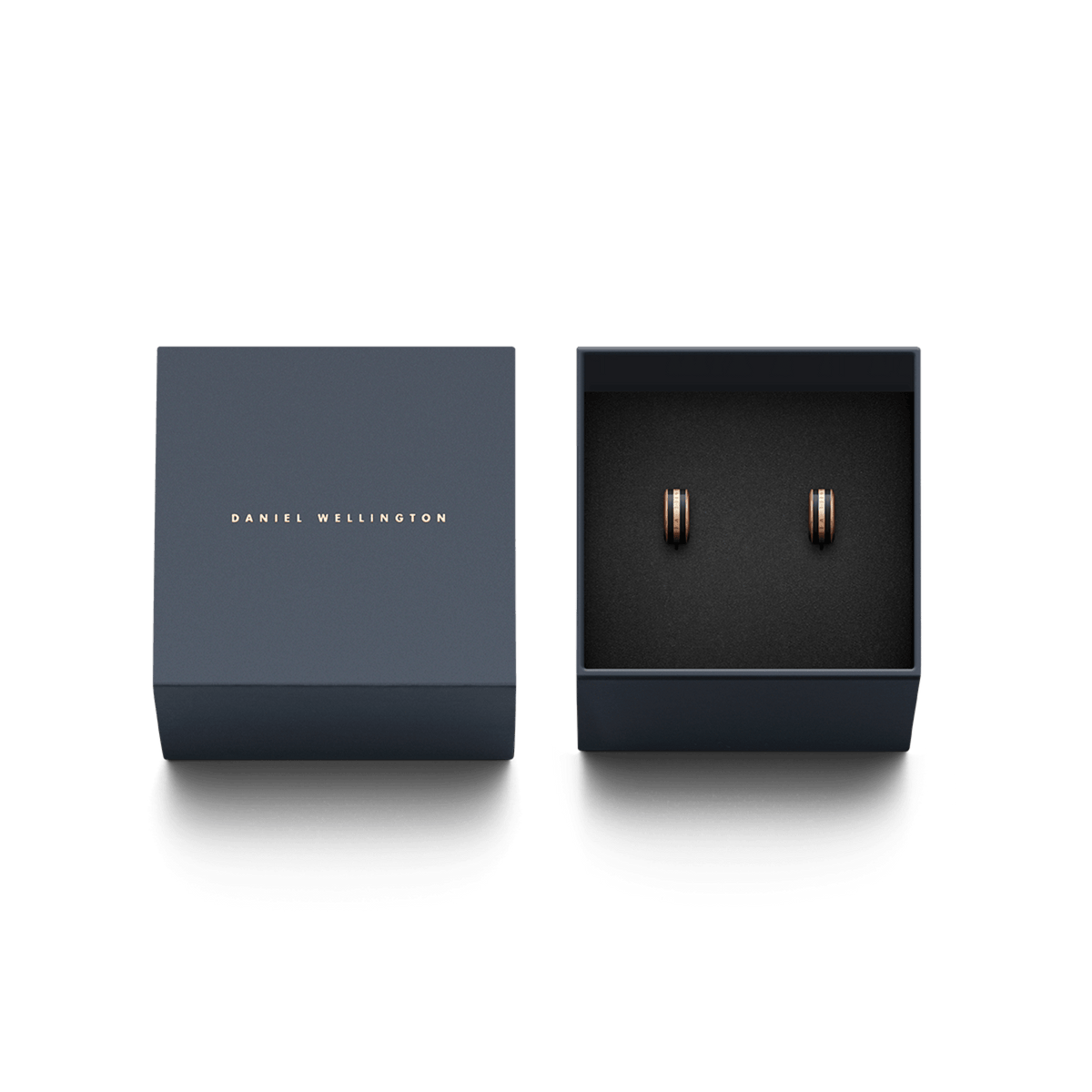 Emalie Earrings Rose Gold Black displayed in an elegant Daniel Wellington gift box, featuring petite huggie earrings with rose gold and black enamel detailing, ideal for gifting or adding a refined touch to any jewellery collection.