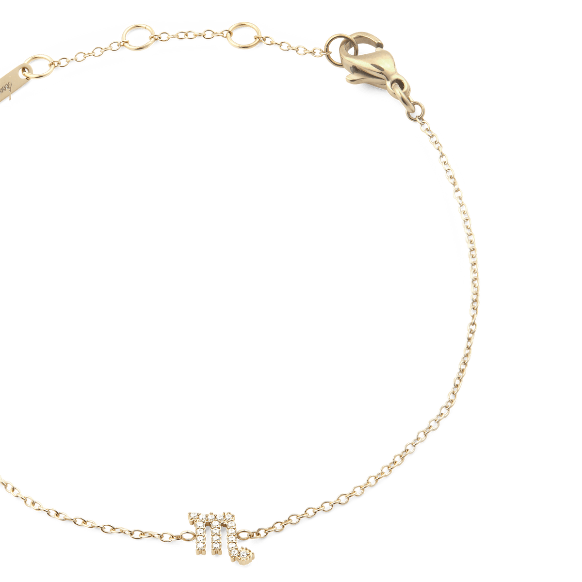 Close-up of the Crystal Zodiac Chain Bracelet Gold, highlighting the fine gold chain, adjustable sizing rings, and a sparkling Scorpio zodiac charm set with crystals.