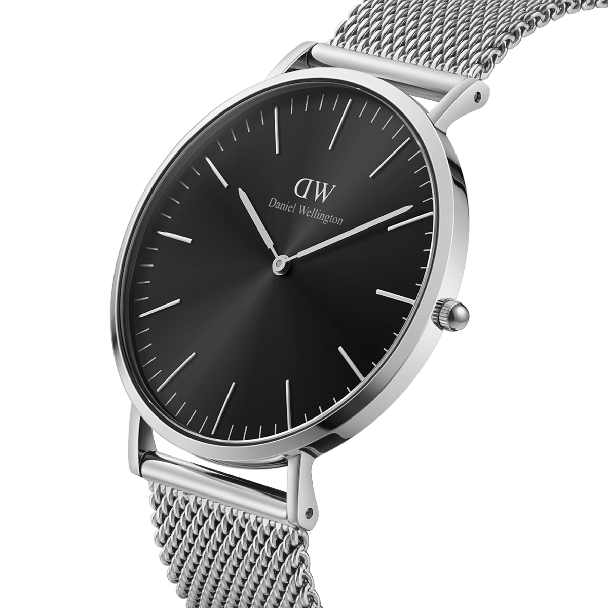 Classic Mesh Onyx silver watch featuring a black sunray dial, slim line markers, and a stainless steel mesh strap, shown in a close-up angle to highlight its minimalist and elegant design.