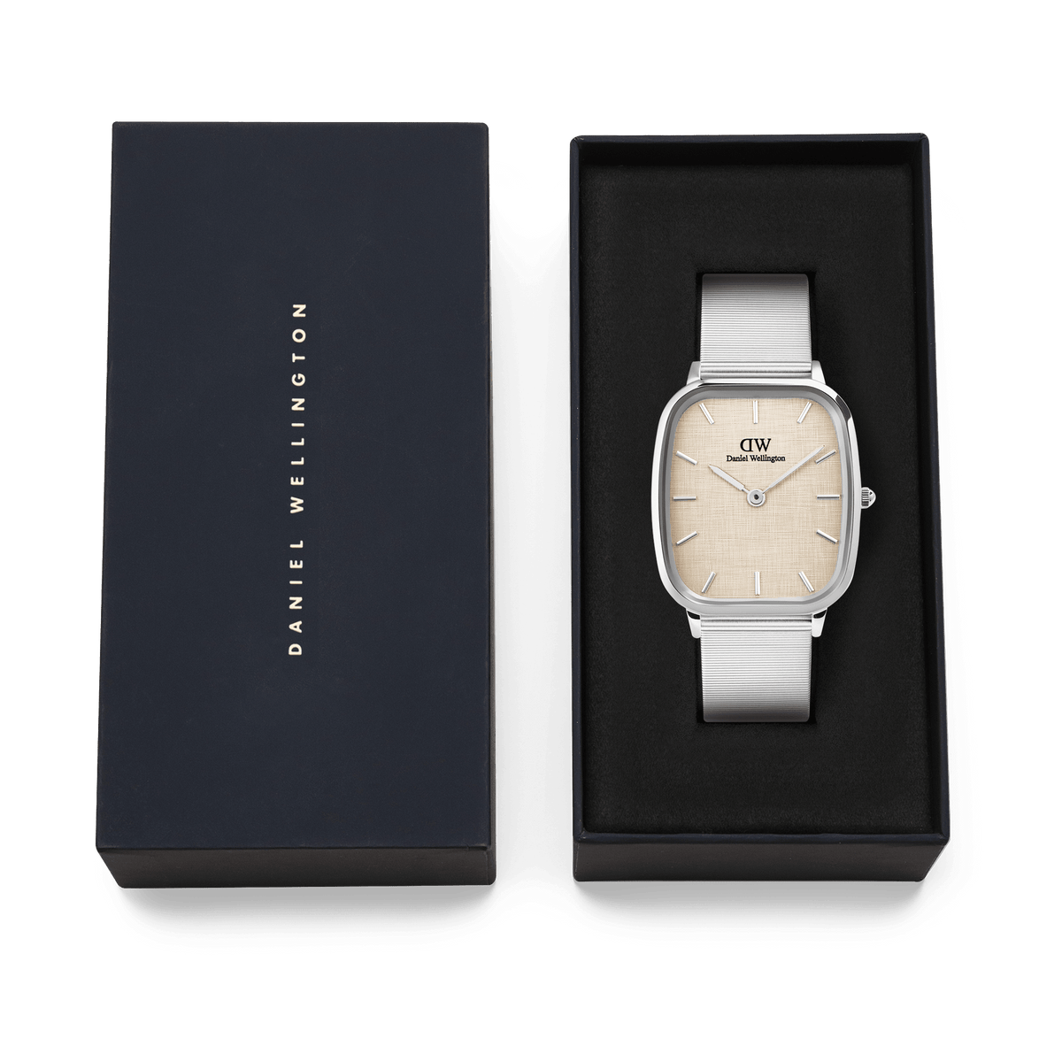 Marlon Wire Linen Silver men’s watch with a rectangular stainless steel case and silver mesh strap, presented in a black Daniel Wellington gift box with a soft yellow linen-textured dial.