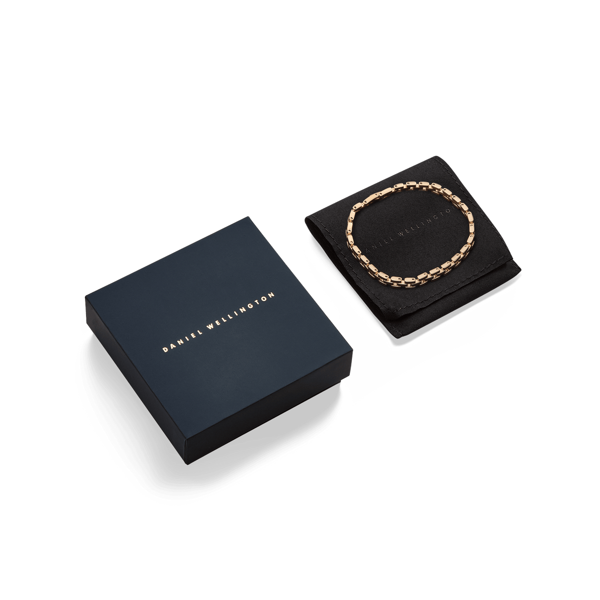 3-Link Bracelet Gold displayed on a black pouch next to a Daniel Wellington gift box, highlighting the bracelet’s polished gold links and elegant presentation for gifting.