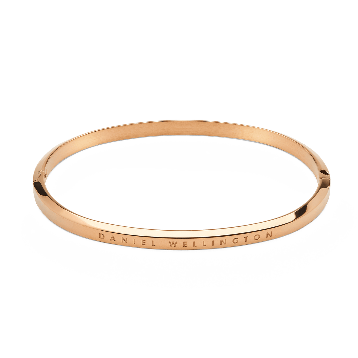 Minimalist Classic Bangle Rose Gold with a smooth, polished finish and DANIEL WELLINGTON engraved on the outer band, crafted from stainless steel with a secure hinge and lock closure.