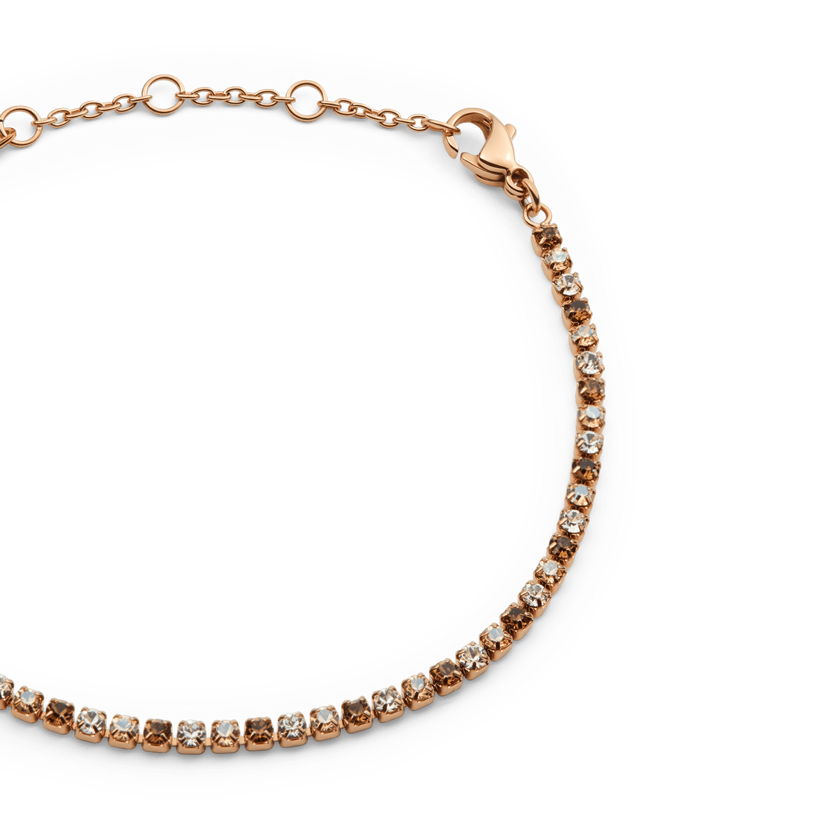 Close-up of the Classic Tennis Bracelet Honey Combo Rose Gold, showing alternating honey and clear crystals set in a slim rose gold chain with an adjustable lobster clasp.