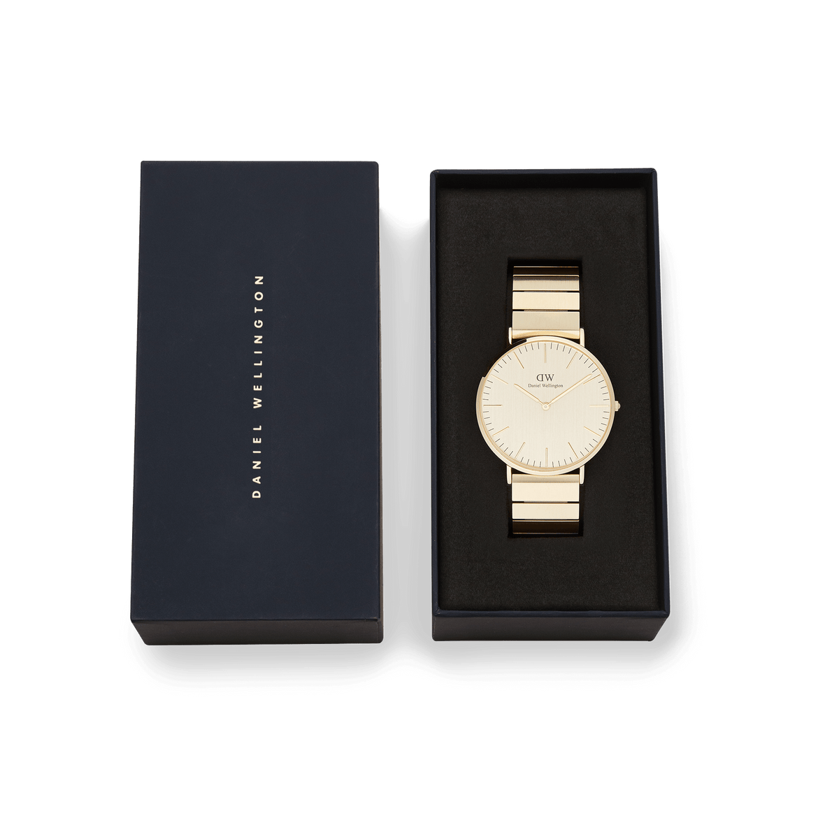 Classic Piano Link Gold Unitone watch with a brushed gold dial and piano link bracelet, presented in a black Daniel Wellington gift box.