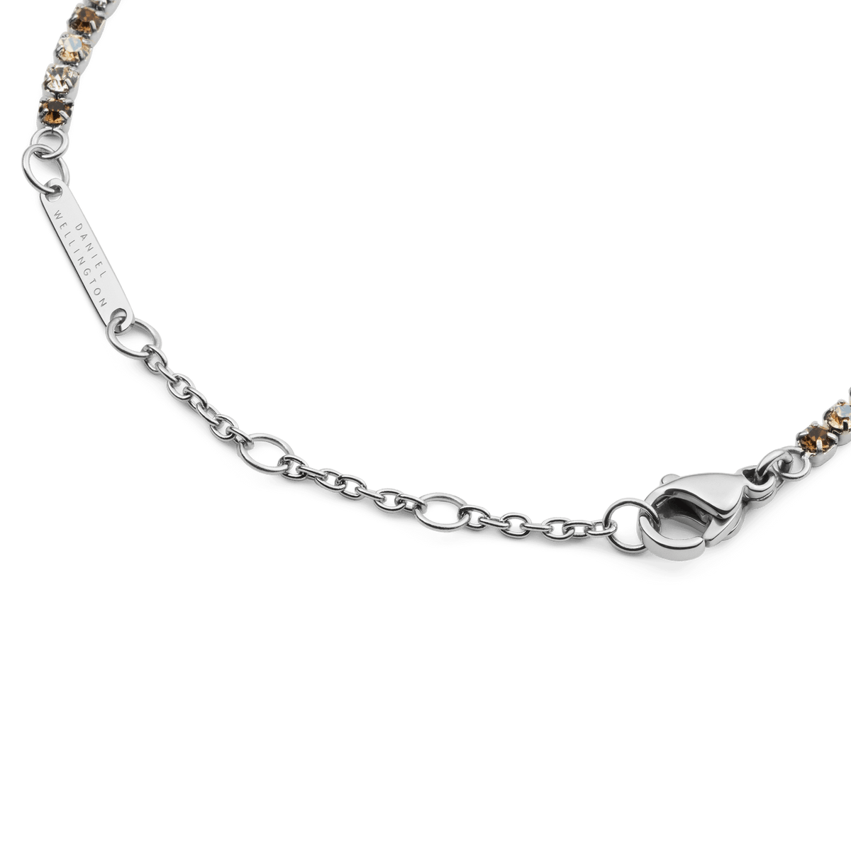Detail of the Classic Tennis Bracelet Honey Combo Silver, highlighting the adjustable silver chain, lobster clasp, and alternating honey and clear crystals.