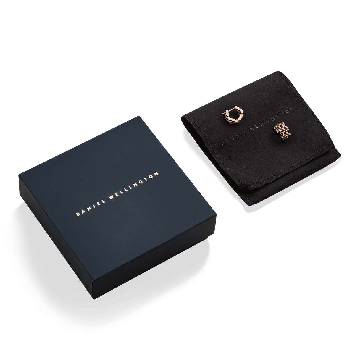 Daniel Wellington 5-Link Earrings Rose Gold displayed on a black pouch alongside a branded navy gift box, highlighting the elegant mini hoop design and premium packaging.