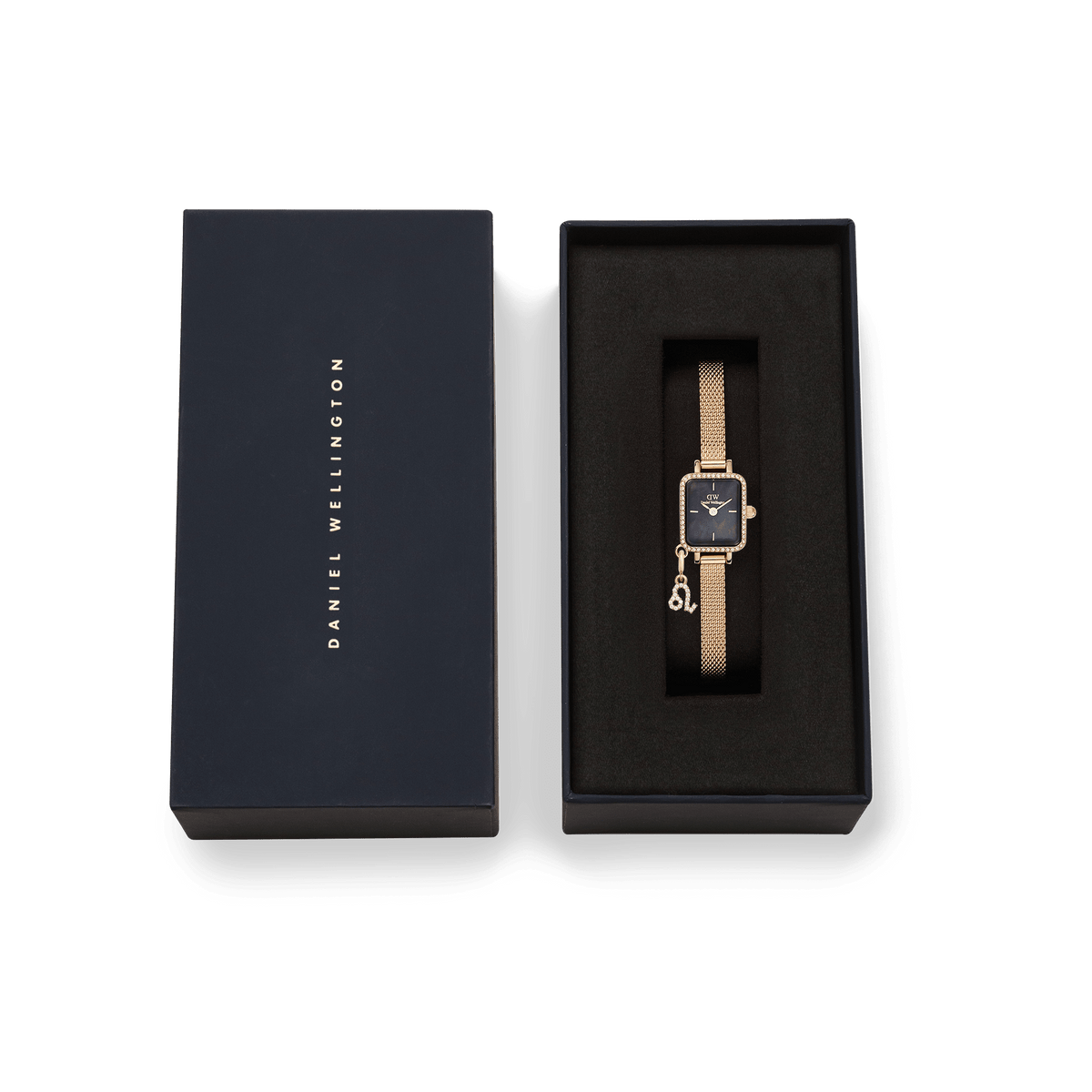 Daniel Wellington Quadro Mini Crystal Zodiac Evergold Set presented in its gift box, featuring a gold mesh strap, crystal-framed rectangular case, black mother of pearl dial, and a crystal zodiac charm.