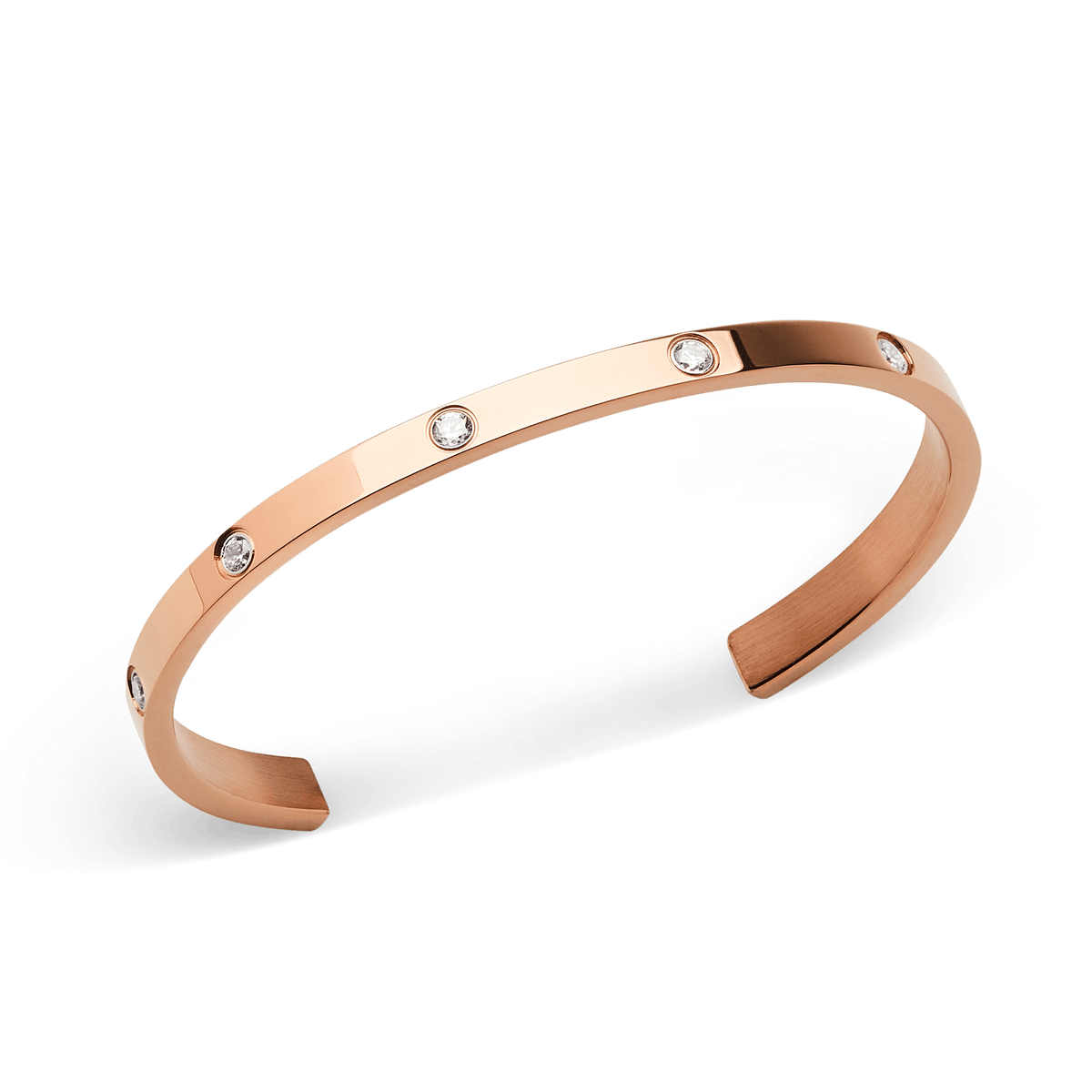 Classic Lumine Bracelet Rose Gold 55mm shown at an angle, highlighting its polished rose gold finish and eight sparkling cubic zirconia crystals set along the slim, open cuff design.