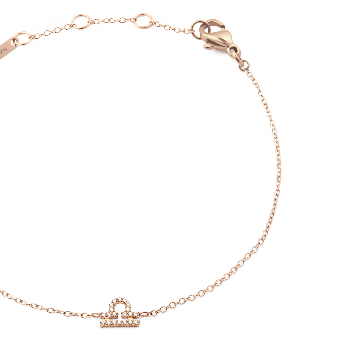 Close-up of the Crystal Zodiac Chain Bracelet Rose Gold, highlighting the fine rose gold chain, adjustable sizing rings, and a sparkling crystal Libra zodiac pendant.