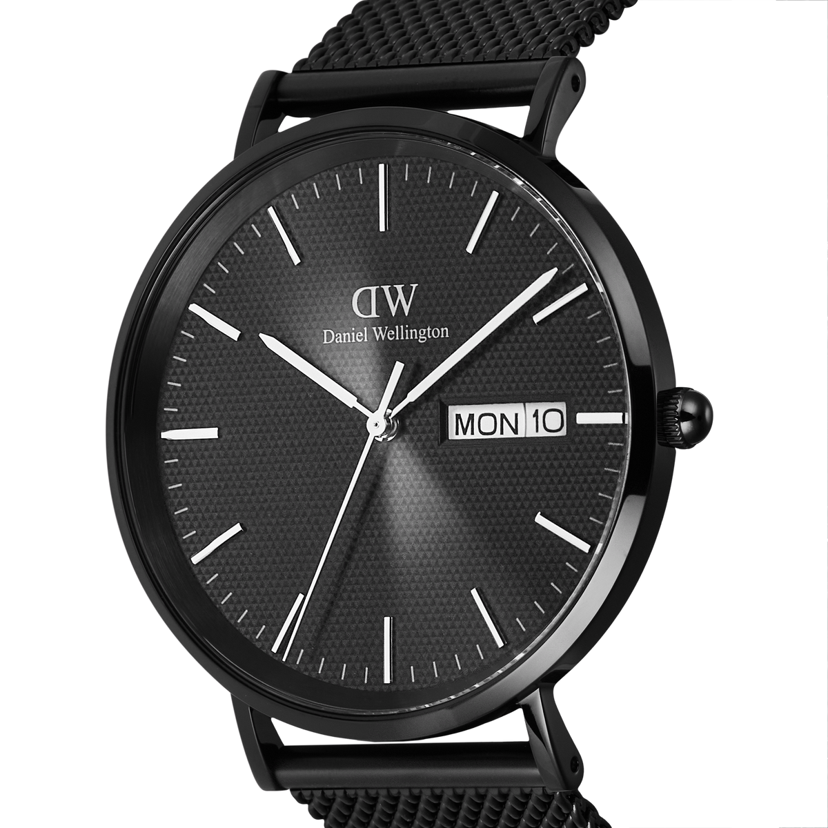Close-up of the Classic Day Display Onyx Black watch showing its textured black dial, minimalist hour markers, and clear day and date display, paired with a black mesh stainless steel strap.