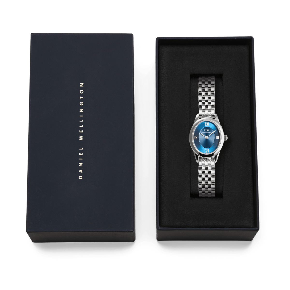 Ophelia Mini Arctic Silver ladies watch with a polished silver oval case, blue sunray dial, and slim 5-link bracelet, presented in a Daniel Wellington branded gift box.