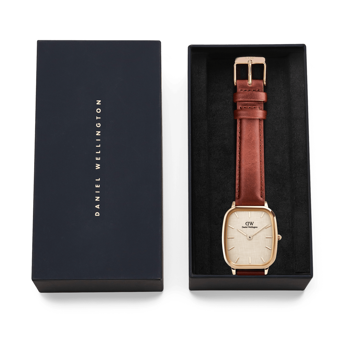 Marlon St Mawes Linen Rose Gold men’s watch with a rectangular rose gold case and brown leather strap, elegantly presented in a black Daniel Wellington gift box.
