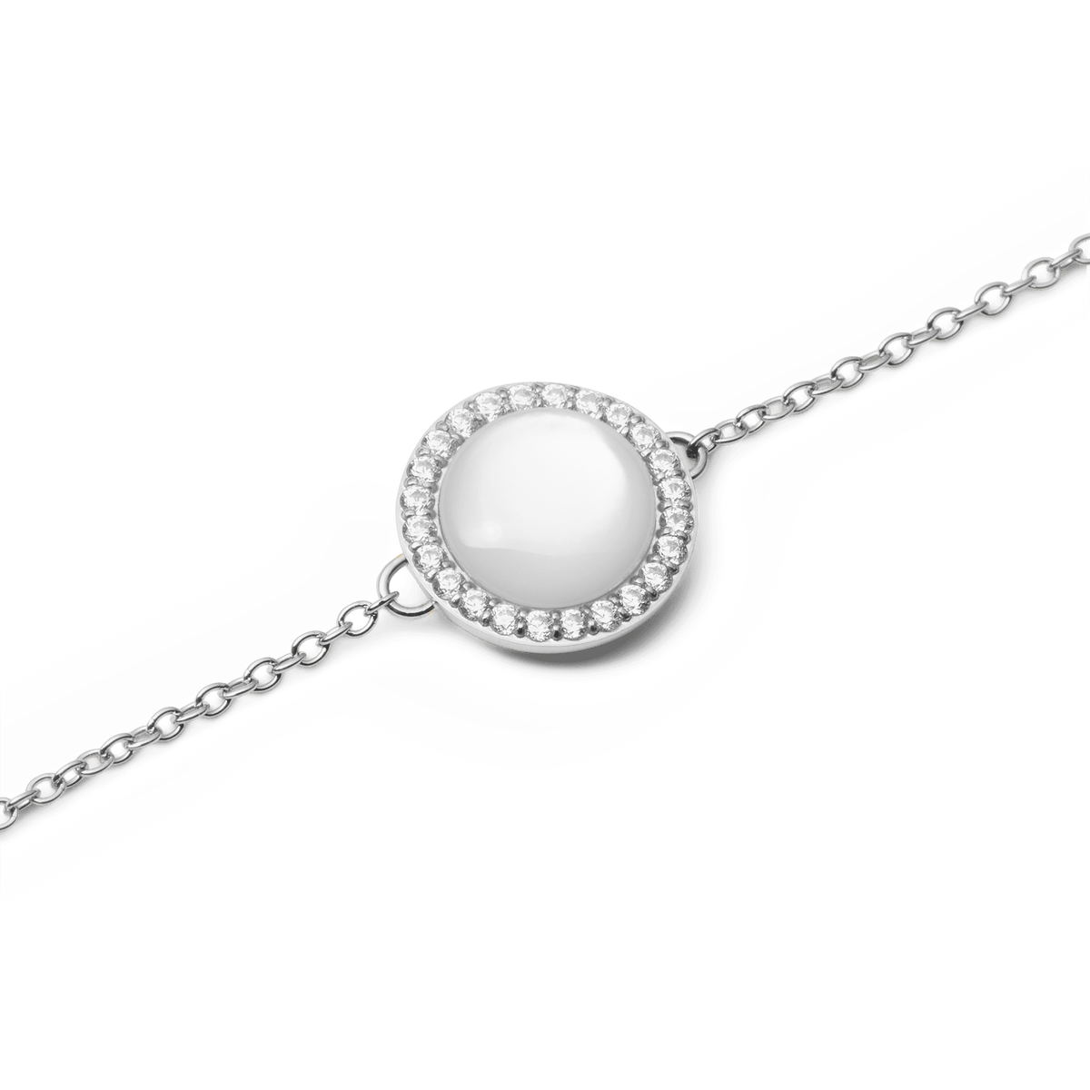 Close-up of the Audrey Bracelet Mother of Pearl Silver, highlighting the luminous mother of pearl centre encircled by sparkling cubic zirconia crystals on a fine silver chain.