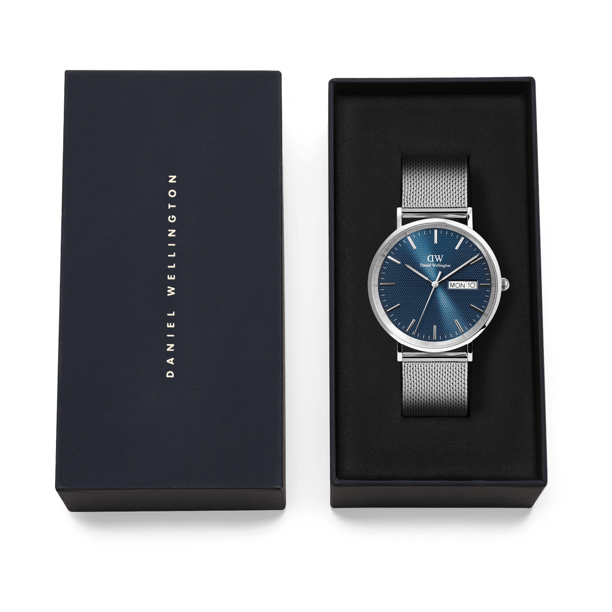 Classic Day Display Sterling Arctic men's watch with a blue patterned dial and stainless steel mesh strap, presented in a Daniel Wellington branded gift box.