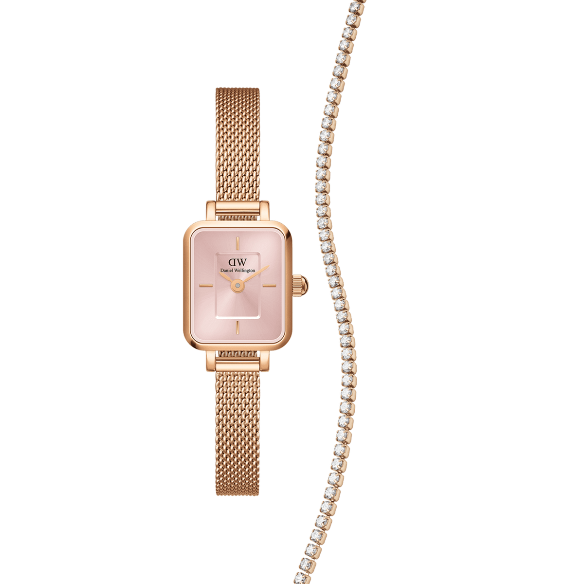 Rose gold Daniel Wellington Quadro Mini Blush Melrose watch with a soft pink rectangular dial and mesh strap, paired with a sparkling tennis bracelet featuring clear stones, styled as a coordinated jewellery set for women.